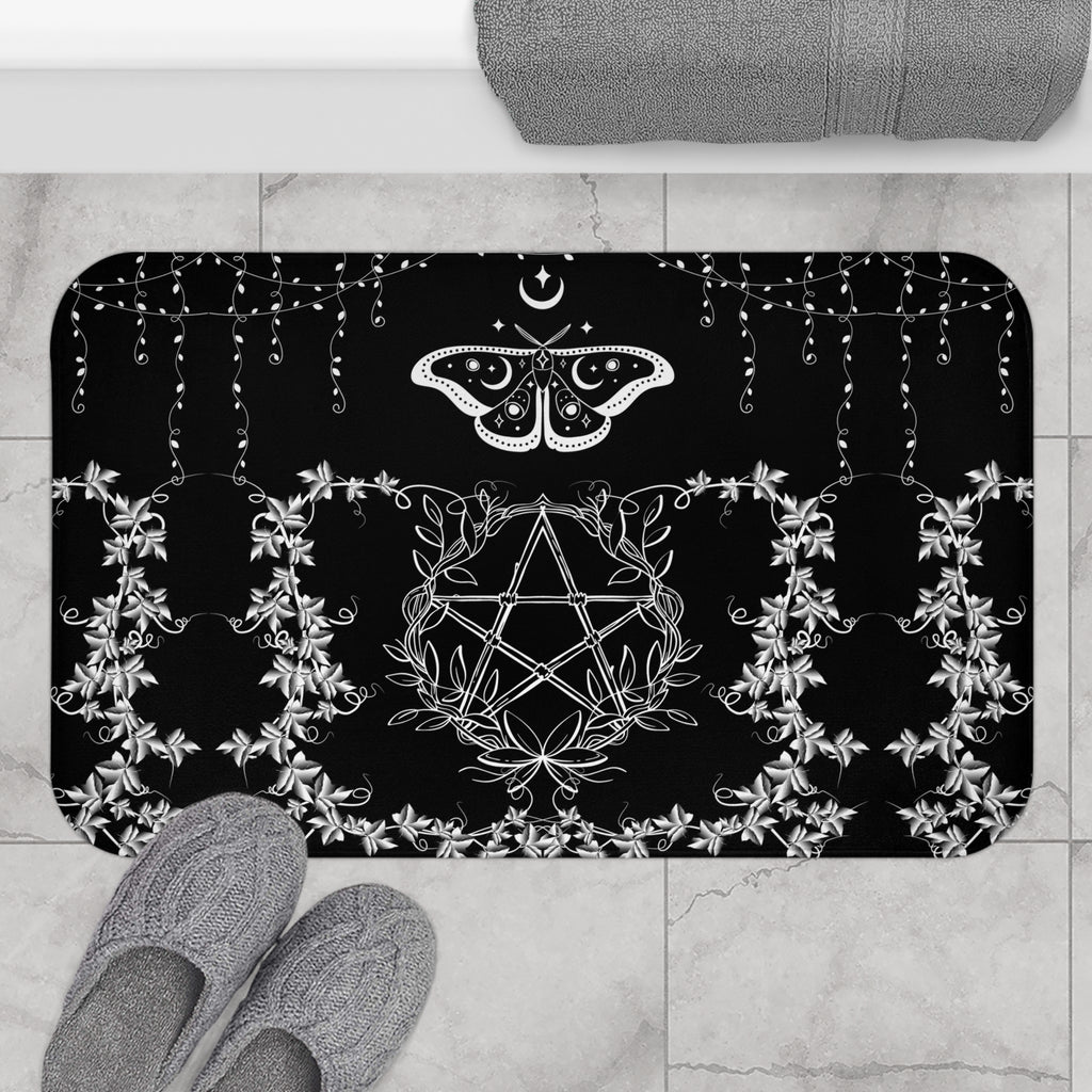 Gothic black bath mat with white linework pentagram wrapped in floral vines and a luna moth with crescent moon markings