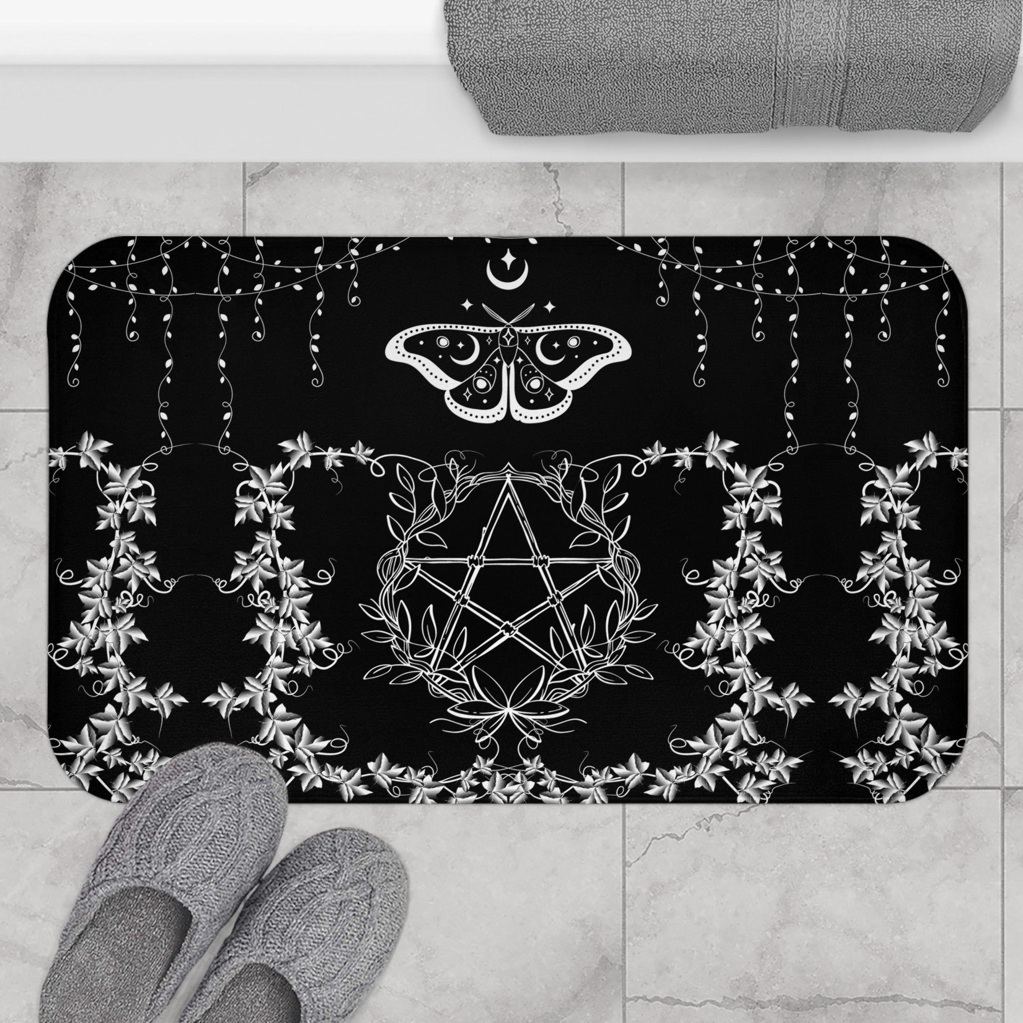 Gothic black bath mat with white linework pentagram wrapped in floral vines and a luna moth with crescent moon markings
