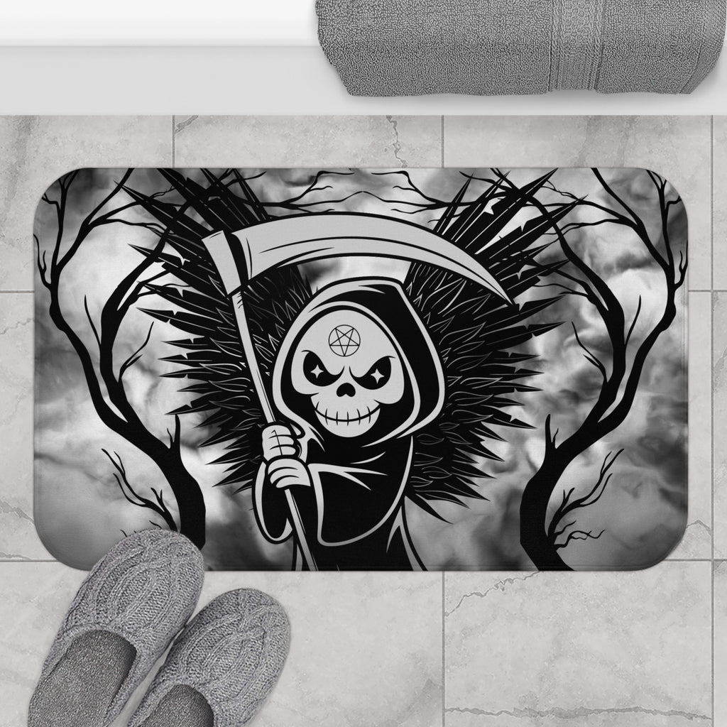 Gothic bath mat with a grim reaper holding a scythe with dark feathered wings surrounded by bare twisted branches against a swirling grey mist background in bold black and grey displayed on marble tile flooring