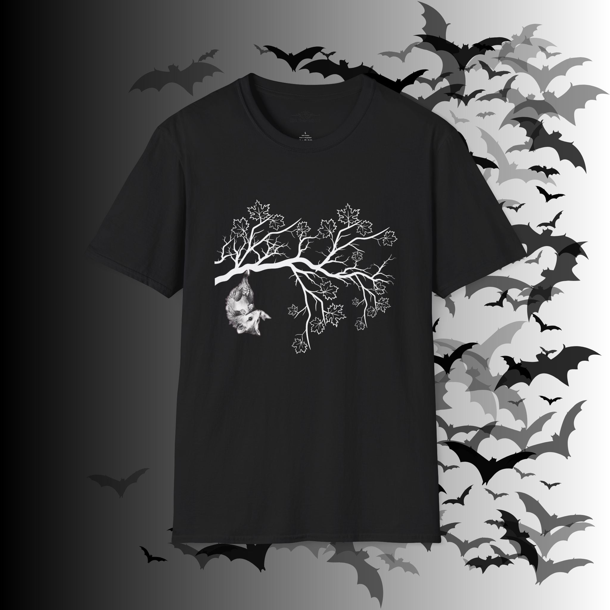 Black t-shirt with white detailed illustration of a baby possum hanging upside down from a bare branch with maple leaves