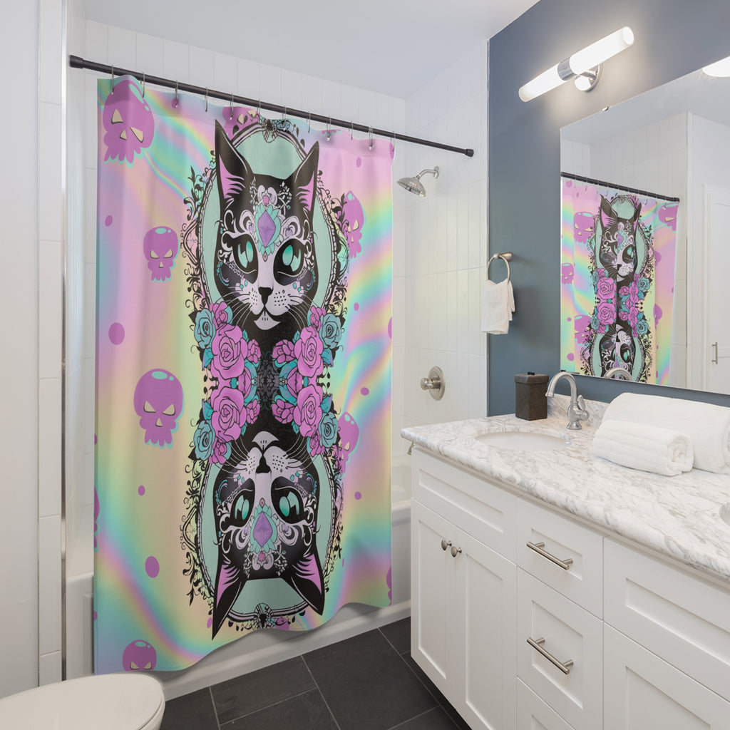 Pastel goth shower curtain with mirrored sugar skull cats with teal gem eyes and pink roses on a holographic rainbow pastel background with pink skull icons displayed in a white bathroom