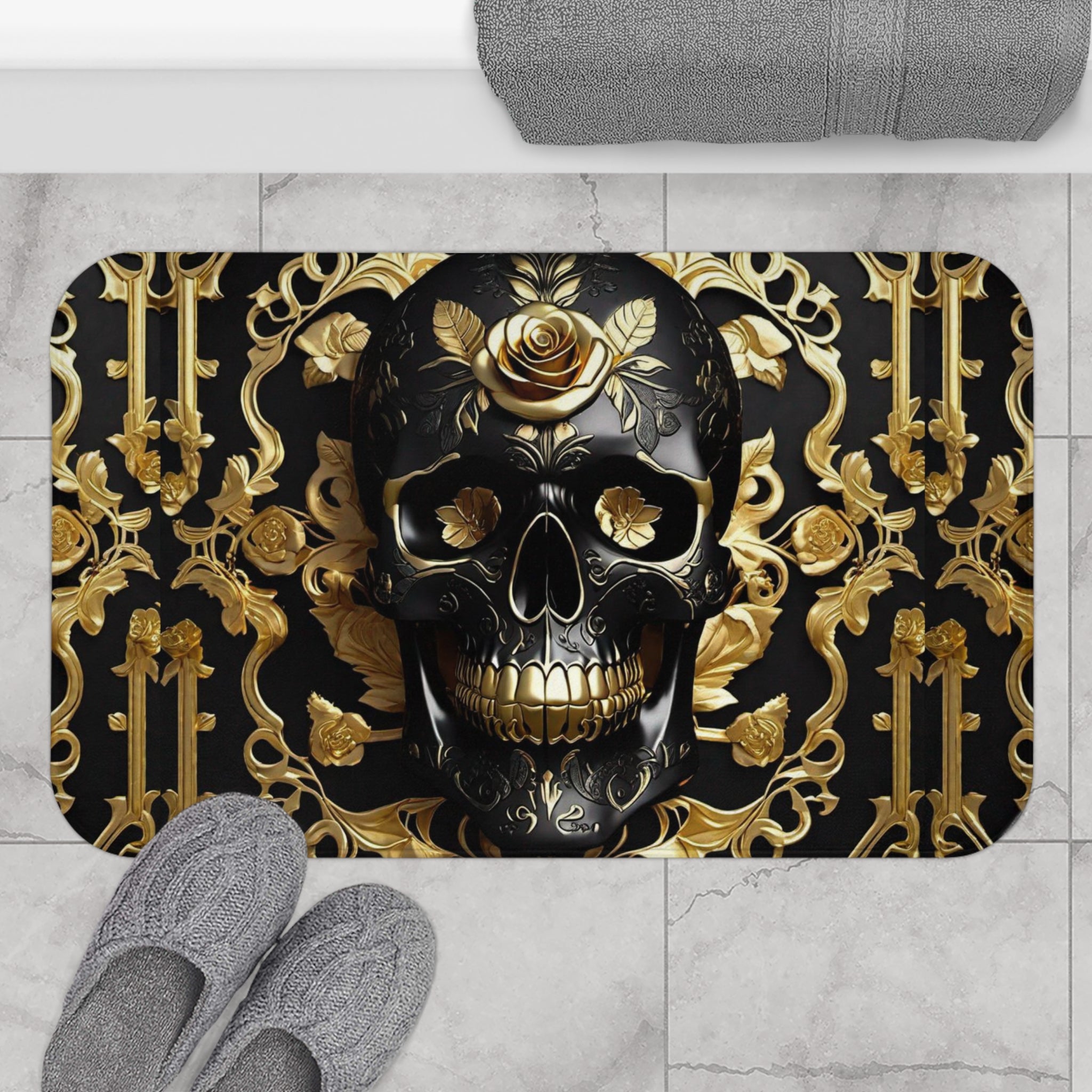 Gothic bath mat with a large black skull with gold rose crown centered on a gold baroque scrollwork and rose wallpaper pattern on deep black displayed on marble tile flooring