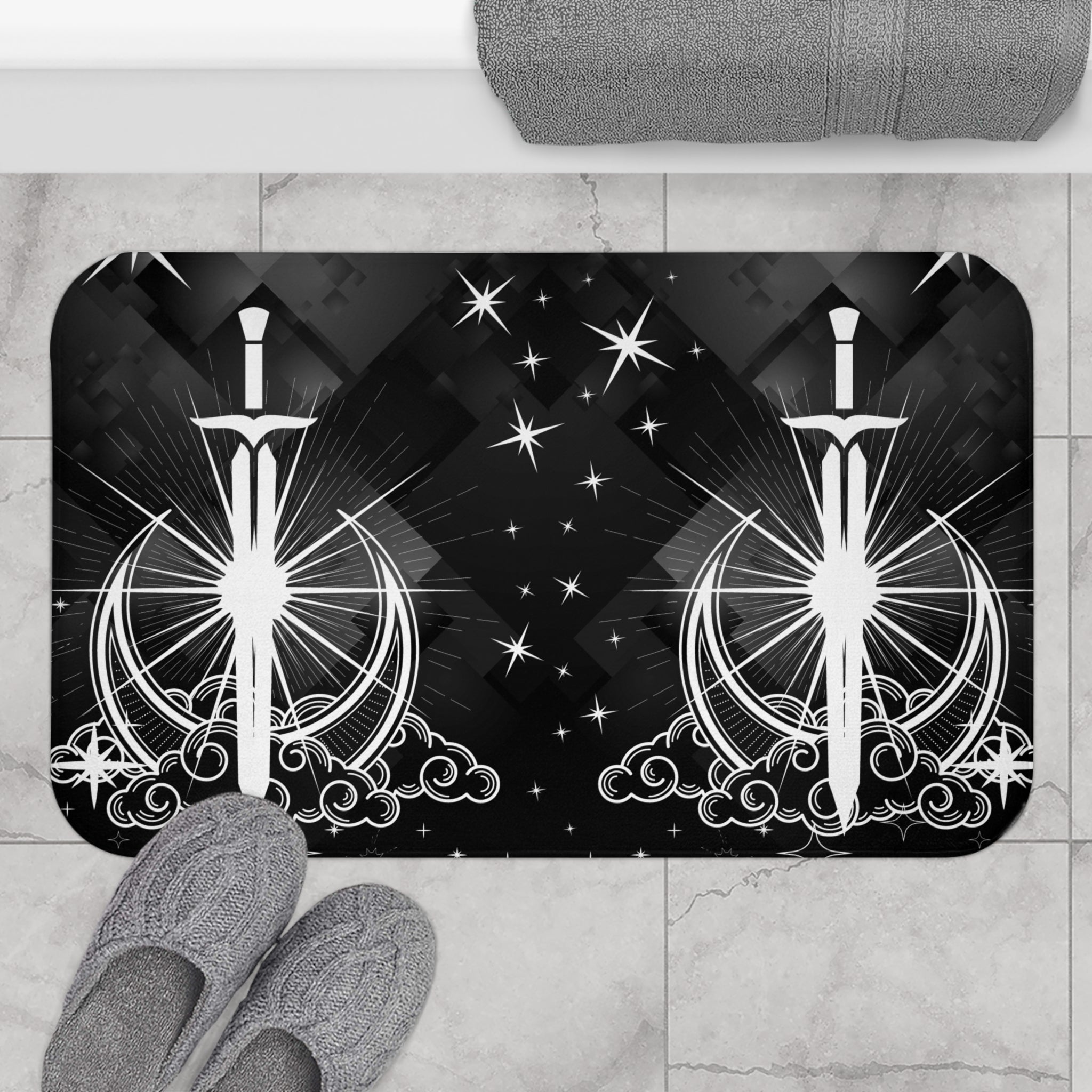 Gothic bath mat featuring mirrored celestial swords piercing crescent moons with starburst linework and star accents on a black geometric background