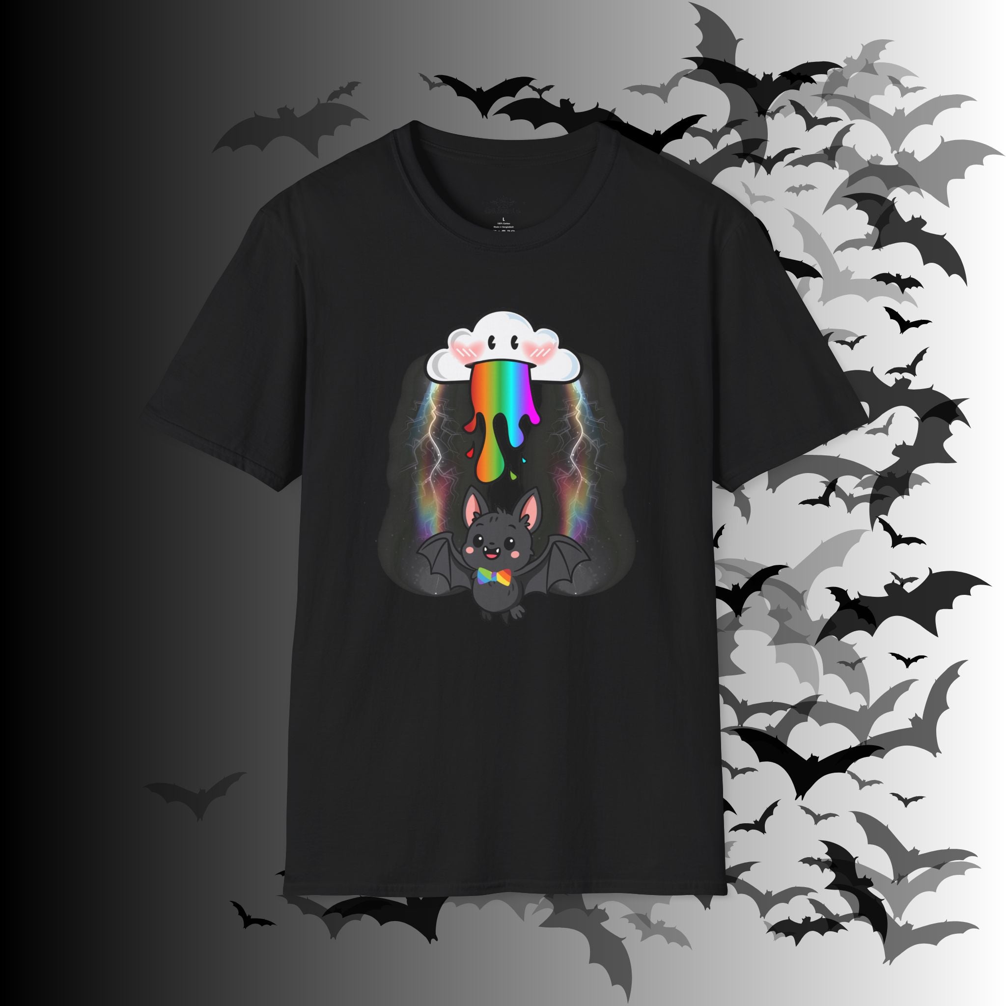 Black unisex t-shirt with a kawaii cloud with rosy cheeks dripping rainbow with lightning bolts and a small happy bat wearing a rainbow pride bow tie with wings spread beneath it on a chest print