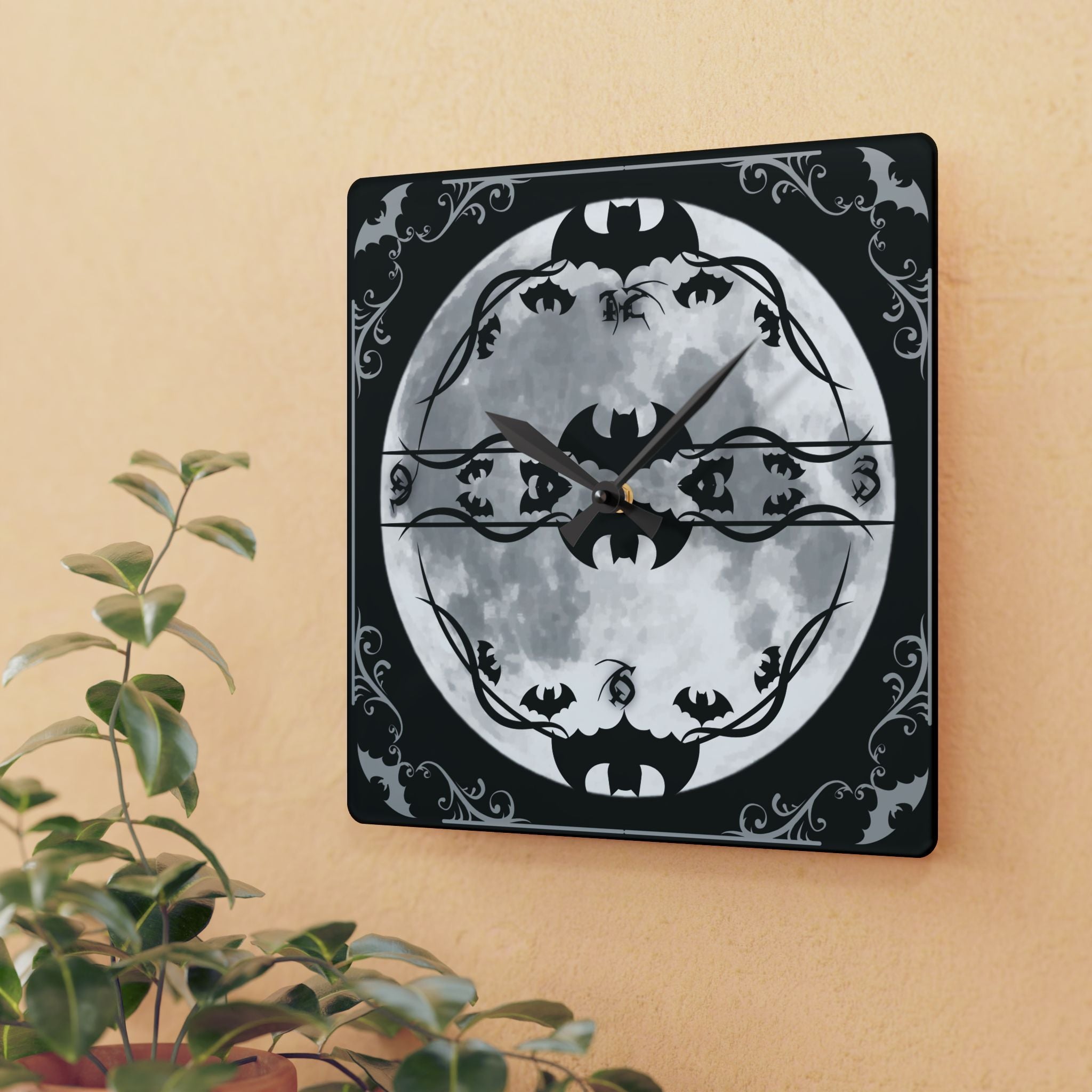 Square acrylic wall clock featuring a luminous full moon clock face with bat silhouette hour markers gothic blackletter numerals vine tendril inner frame and ornate baroque bat wing filigree filling the black corners with black hour and minute hands