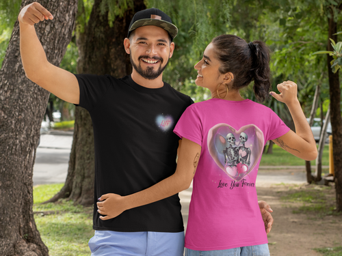Black and pink t-shirts front and back with two skeletons sitting together inside a glossy pink heart with pink balloon hearts and "Love You Forever" script