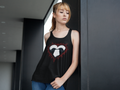 Black racerback tank top with two ravens facing each other inside a white heart surrounded by jagged crimson thorns on a black background