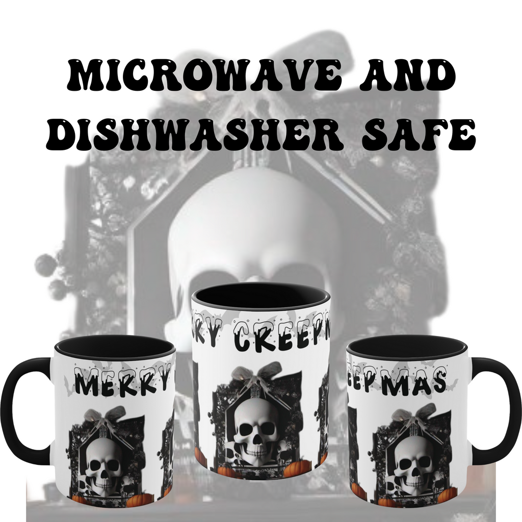 White ceramic mug with black accent interior and handle featuring a gothic skull in ornate frame with bow, wreath, pumpkins, and "Merry Creepmas" dripping lettering
