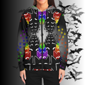 Person wearing a hoodie with colorful bat designs on a dark background with bats.