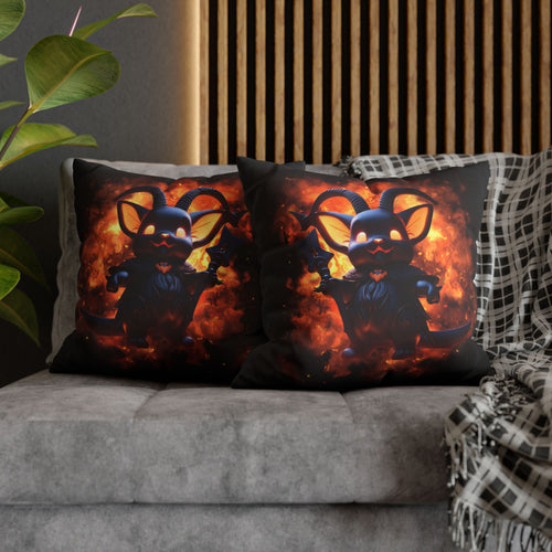 Two square throw pillows on a grey sofa featuring a chibi-style dark navy Baphomet figure with ram horns, bat wings, glowing orange eyes, and a small heart emblem on its chest, set against a roiling explosion of deep orange and gold flames