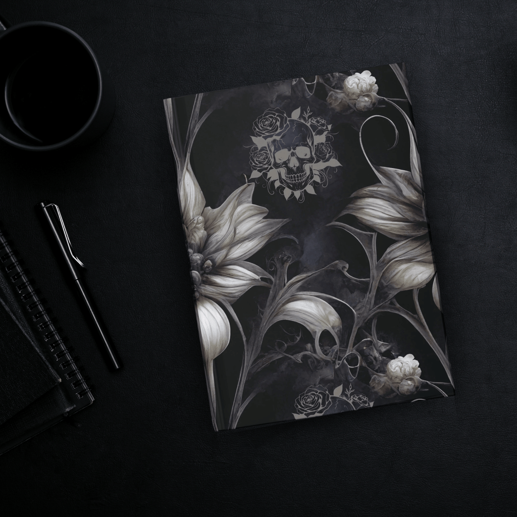 Gothic hardcover journal with oversized ivory flowers, skeletal dark vines, and a rose-crowned skull on a smoky black background