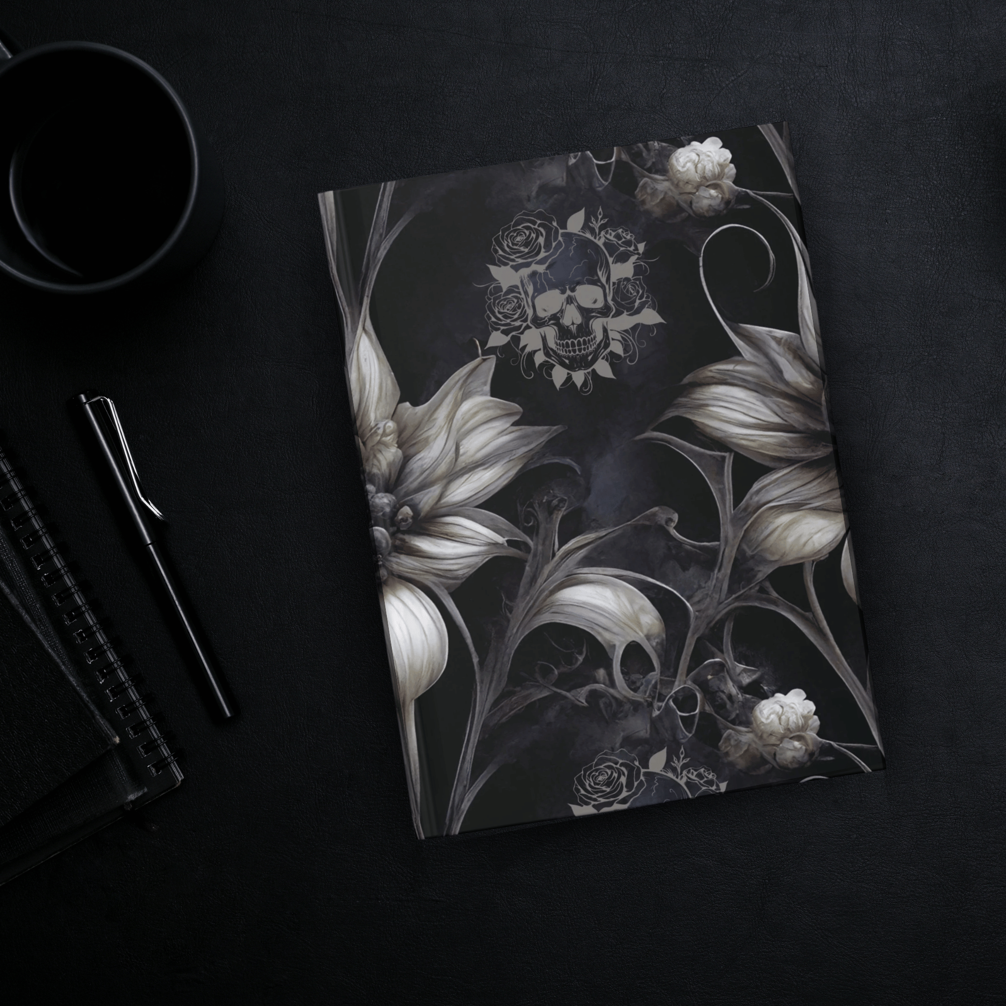 Gothic hardcover journal with oversized ivory flowers, skeletal dark vines, and a rose-crowned skull on a smoky black background