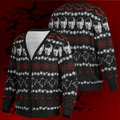 Black sweater with Halloween-themed patterns on a dark red background