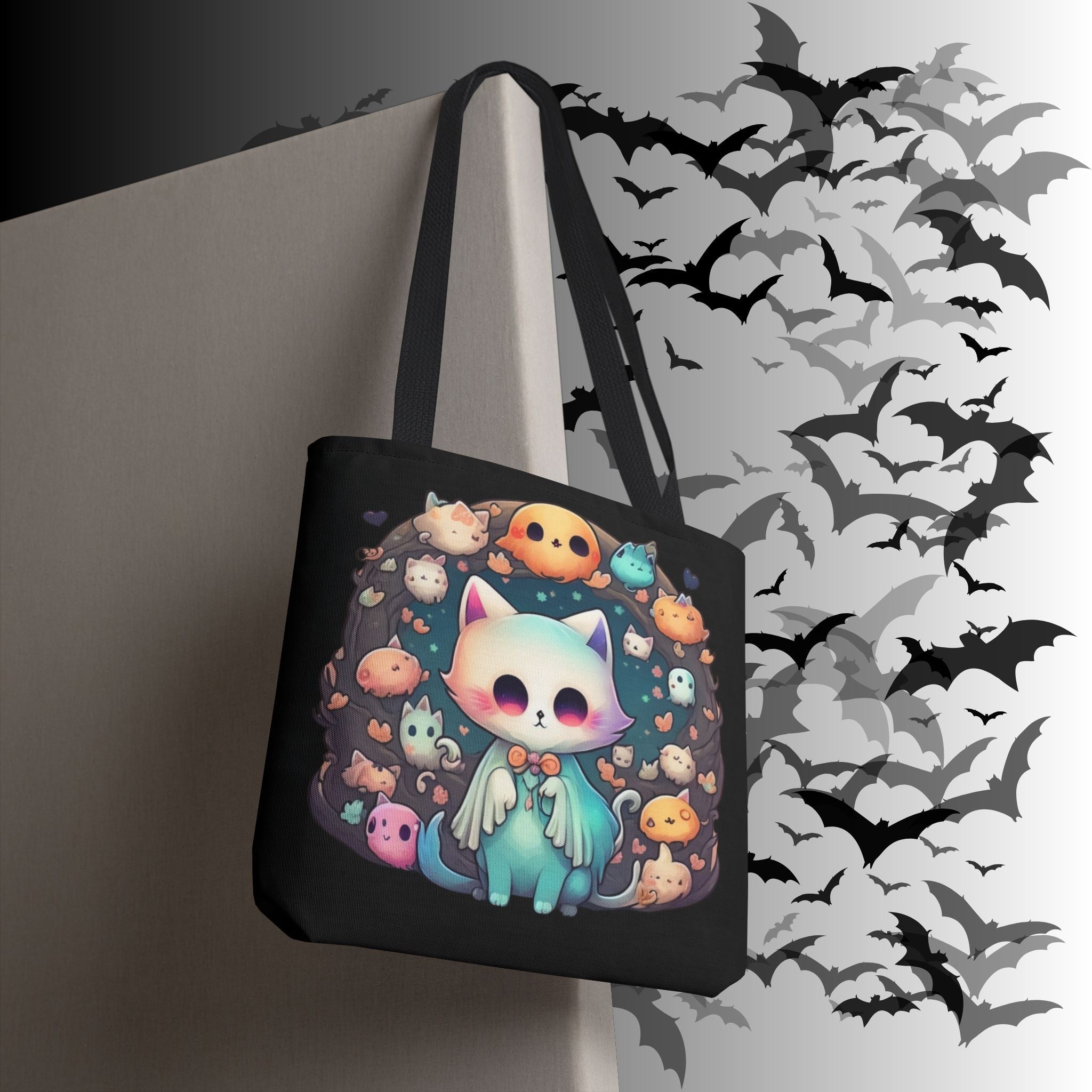Black polyester tote bag with pastel teal cloaked cat surrounded by a ring of chibi ghost cats, mini pumpkins, and glowing creatures in candy-soft tones
