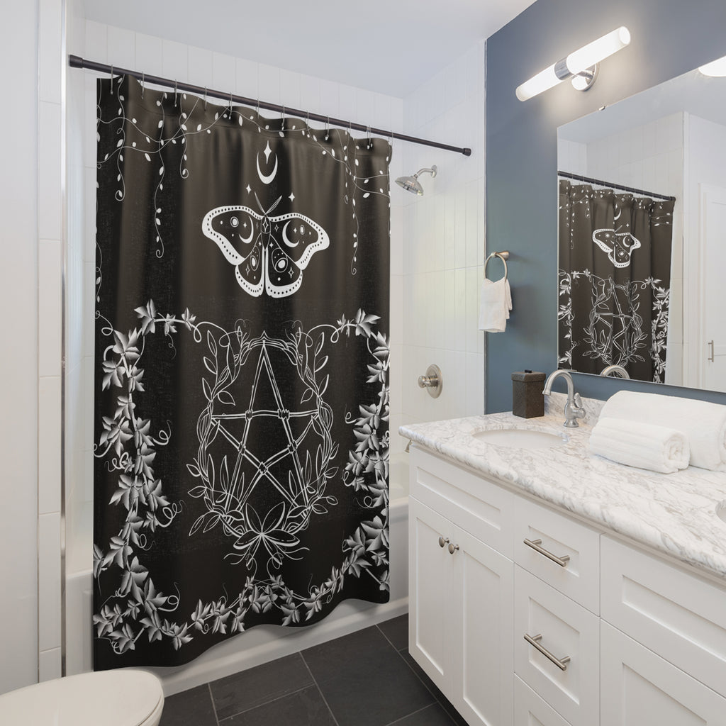 Gothic shower curtain with white linework luna moth above a botanical pentagram surrounded by white florals and vines on a deep black background displayed in a white bathroom
