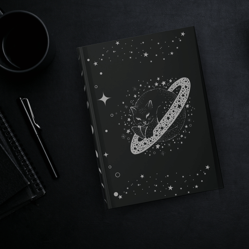
Gothic hardcover journal with grey linework black cat curled inside a Saturn-like planetary ring surrounded by stars and cosmic dots on deep black background