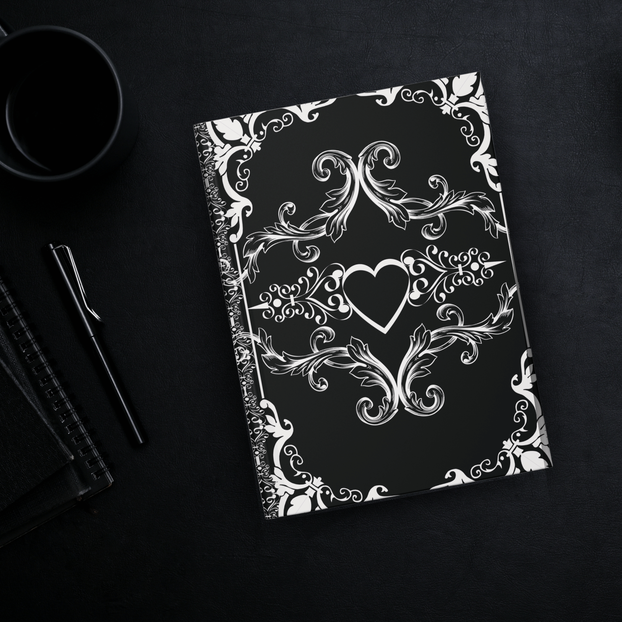 Gothic hardcover journal with white Victorian baroque scrollwork and hearts on a deep matte black background